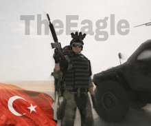 a man with a gun stands in front of a turkey flag and the word the eagle behind him