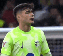 a soccer player is wearing a neon green shirt with the number 11 on it