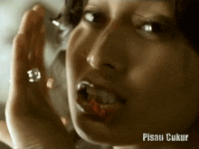 a close up of a woman 's face with the words pisau ukur below it