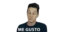 a man wearing a black shirt with the words me gusto written on it