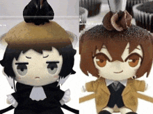 two stuffed dolls are sitting next to each other with cupcakes on top of them