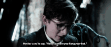 a young boy wearing glasses says mother used to say home is where you hang your hat