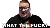 a man with glasses and a black shirt is asking what the fuck .