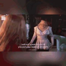 a woman in a white shirt is holding her head and says i will not speak to you till you put your head on straight