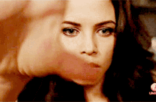 a close up of a woman 's face with the word lifetime on the bottom right