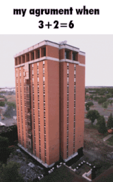 a tall brick building with the words my agrument when 3 + 2 = 6 on the top