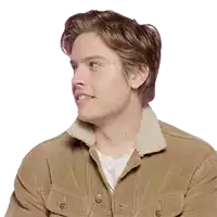 a man wearing a brown jacket with a white collar