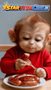 a baby monkey is eating sausages with a fork in front of a sign that says star tamilchat.in