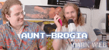 two men are sitting in front of a microphone and the words aunt-broglia dark web are on the bottom