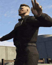 a man in a sheriff 's uniform is waving