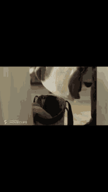 a person is putting a piece of paper in a trash can