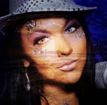 a woman wearing a cowboy hat and a necklace