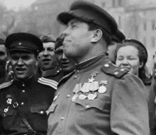 a man in a military uniform with medals on his shoulder