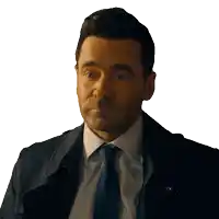 a man in a suit and tie is looking at something