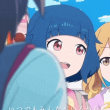 a girl with blue hair is looking at another girl with blonde hair