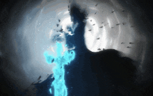 a statue of liberty is surrounded by a blue flame