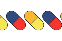 a row of colorful pills are lined up in a row on a white background
