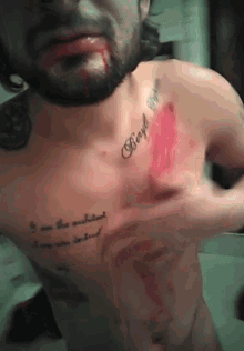 a man with a tattoo on his chest that says boyd on it