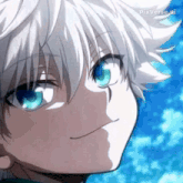 a close up of a person with white hair and blue eyes smiling .