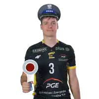 a man wearing a black and yellow pge jersey