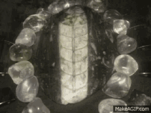 a black and white photo of a bracelet made of clear beads