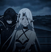 a woman with long white hair and a choker stands next to a man with a hood