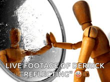 a wooden mannequin standing in front of a mirror that says live footage of derrick reflecting