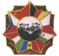 a group of men are standing in a circle in a star shaped emblem with flags on it