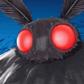 a close up of a moth with red eyes against a blue background