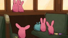 a group of pink stuffed bunny rabbits are sitting on a green chair