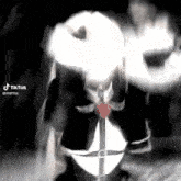 a woman in a maid costume is holding a sword in her mouth .