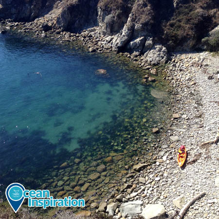 An overhead view of a kayak pulled out on shore in Gerstle Cove in Greater Farallones National Marine Sanctuary.